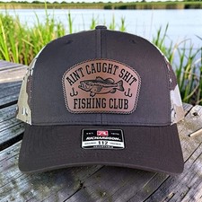 Funny Leather Patch Hat: Ain't Caught Sh*t Fishing Club Richardson 112 Trucker H picture