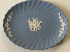 Small Wedgwood Jasperware plate, 7 X 5” oval, floral, matte blue, raised white picture