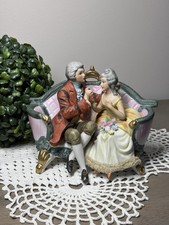 Cucci Royal Crown Porcelain Figurine Victorian Couple On Couch Vintage 1970s picture