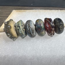 Gorgeous artisan made dark and spooky bead set. Textures, glitter, and sparkle picture