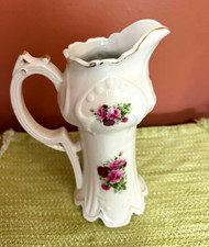 Vintage floral, ceramic pitcher/ vase formalities by Baum Brothers￼ picture