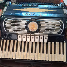 This is a vintage Italian-made Titano Palmer-Hughes Grand piano accordion picture