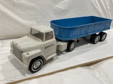 1960'S ERTL INTERNATIONAL LOADSTAR SEMI TRUCK W/HYDRAULIC DUMP TRAILER. NICE picture