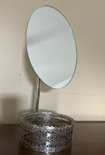 Vintage Silver-Tone Oval Vanity Mirror with an Ornate Filigree Storage Base picture