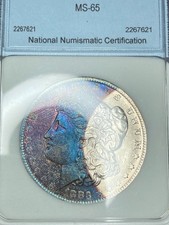 1883-O NNC MS65 (Gem) Morgan Dollar | Vivid Rainbow Crescent Toning | PQ Luster picture