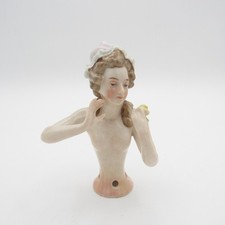 Beautiful Antique Half Doll Wearing Bonnet and Holding a Rose picture