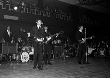 The Beatles pop group performing on stage during a concert in 1963- Old Photo 2 picture