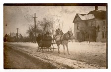 Vintage RPPC Winter Horse Drawn Sleigh Ride Family House Street Postcard picture