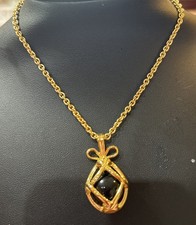 Joan Rivers Caged Egg Necklace With Ten Different Colors To Wear picture