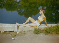1950s WOMAN WEARING BATHING SUIT POSING ON WALL PIN UP Red Border Kodachrome picture