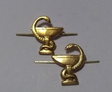 a pair of Soviet military medical service emblems. original. golden color. New picture