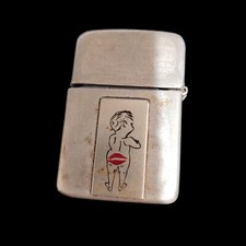VTG WWII era Storm King Naughty Novelty Lighter With Cheeky Design & Kiss Mark picture