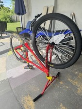 SE Bikes Big Flyer 29” BMX Bike Red/Yellow Cult Camo Rear Maxxis Front picture