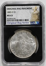 1885 O Morgan Dollar NGC MS-63 w/Original Bag Fragment picture