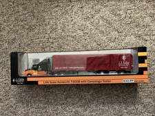 SpecCast J.J. Keller 1:64 Kenworth T-600B w/Conestoga Trailer #830-PP  NIB picture