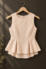 Zara Sleeveless Peplum Top in Blush Pink picture