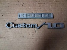 These original factory badges belong to a 1969–1972 Chevrolet C10 pickup truck picture