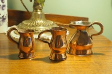 3 Antique copper whisky measures one stamped Dundee picture