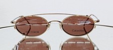Vintage CALVIN KLEIN Eyeglasses CK516 053 w/ Sun Clip On 48-20 Titanium Brass picture