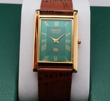 Vintage Seiko Slim Quartz Men's Wrist Watch Green Dial with Light Brown Strap. picture