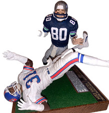 Custom McFarlane NFL football Seahawks Largent revenge hit on Bronco Mike Harden picture
