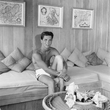 American actor Tony Dow smiling while sitting barechested in swimm- Old Photo picture