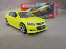 Matchbox 1-125 series #84 Holden VF Commodore SSV Yellow  1/64 Scale Diecast picture