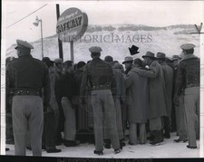 1956 Press Photo Workmen surround Sheriff Enlow in Denver to hear about notice picture