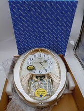 NEW RHYTHM 4MJ447WU18 CHAMPAGNE SNOWFLAKE MUSICAL MOTION WALL CLOCK 18 MELODIES picture