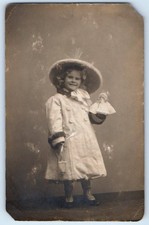 c1910's Smiling Child Girl With Doll And Hat Studio RPPC Photo Antique Postcard picture