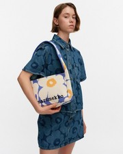 Authentic Marimekko bag with iconic Unikko design.Japan Limited item, very rare picture