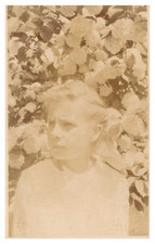postcard Real Photo of woman in front of bloomed flowers 9966 picture