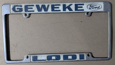 VTG Metal Geweke Lodi Embossed Ford Dealership License Plate Frame Gas & Oil picture