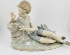 LLADRO BEAUTIFUL FIGURINE BOY PLAYING WITH BIRD.  picture