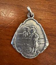 Antique Art Nouveau German Silver Repoussé Sweethearts on Fence Charm or Pendant picture