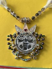 Beautiful Kirk’s Folly Sea view Moon Necklace Wearing A Pink And Jewelled Crown picture