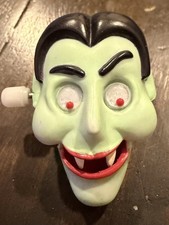 Vintage 1987 Hallmark Wind-Up Lapel Pin Vampire Dracula Head Halloween Toy Works picture