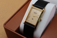 Vintage Seiko Slim Quartz Men's Wrist Watch Gold  Dial with Black Strap. picture