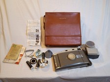 Vintage Polaroid Camera with Accessories and Brown Carrying Case picture