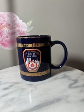 ⁠Official FDNY City Merchandise Coffee Mug Blue Gold Rim The Bravest Shield NYC picture