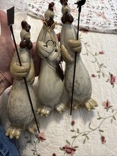 vintage anthropomorphic ceramic chickens holding gardening tools. picture