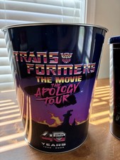 Ships now Transformers The Movie The Apology Tour popcorn tin 40th anniversary  picture